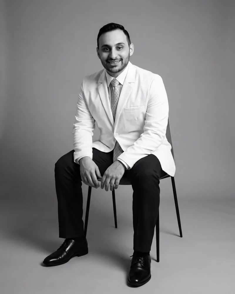 Dr. Jacob J. Pleshty, dentist, seated in a black-and-white studio portrait