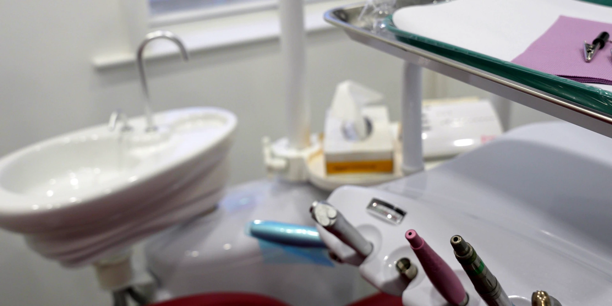 Dental handpieces and cuspidor in a treatment room at the Freeport office